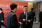 Member from Qingdao Port Communicating with WIFFA's Secretary General, Mr. Kang Shuchun