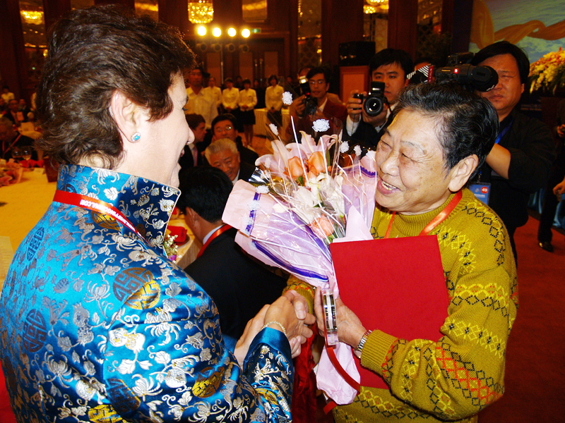 Mrs. Mahin Faphouri congratulates Mrs. Wang Yafu become the Character of China Shipping 60 Years Anniversary